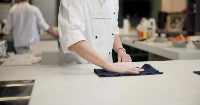 Person, hands and chef and cleaning in kitchen for culinary meal or restaurant hygiene, bacteria or counter. Professional, cook and cloth for hospitality service in health, presentation or cuisine