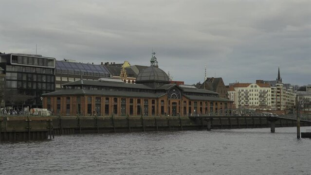 Hamburg, Germany. Coastal facade Altonaer Fischauktionshalle. Landing pier at Altona Fischmarkt. City attraction historic fish auction hall Hamburg-Altona on the Elbe River. 
