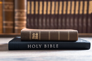 Holy Bibles stacked on top of each other, Christian concept, religious symbol