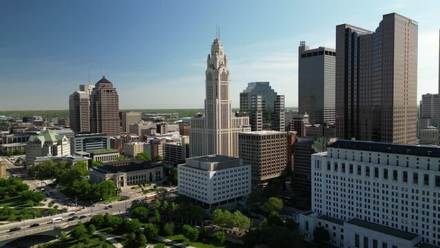 2024 sweeping cinematic wide view of downtown columbus ohio in the morning light showing many skyscraper buildings with an aerial panoramic scope