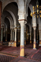 Naklejka premium Interior of Great Mosque of Kairouan with horseshoe arches and multiple columns, Tunisia