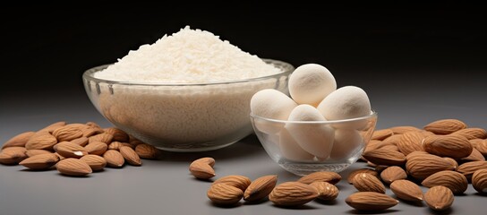 Bowl of almonds and bowl of rice