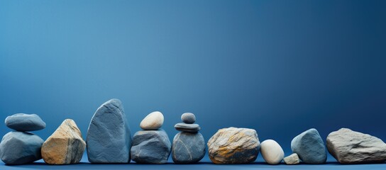 Row of rocks on blue surface