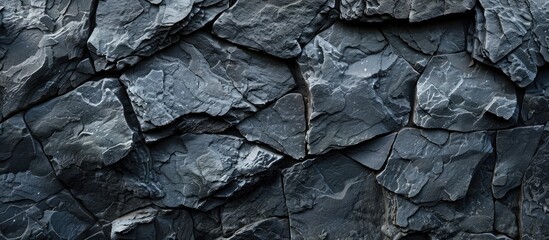 Background with a texture resembling gray stone or slate, as well as a dark stone or slate wall. Has a grungy appearance.