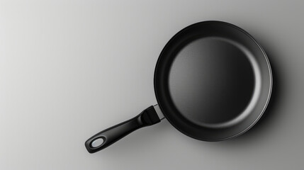 empty frying pan with black plastic handle,copy space
