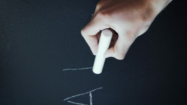 ABCDEF written on chalkboard. Hand writing ABC on blackboard. Vertical video