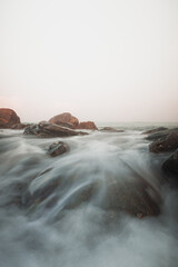 Sea waves and rocks at the sunrice
