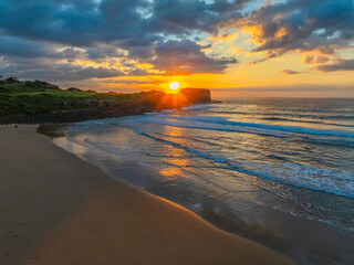 Aerial sunrise views over Bombo Beach at Kiama