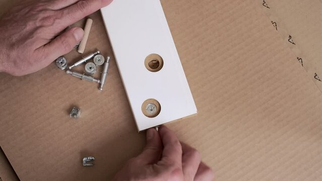 new Cardboard box of home furniture set. furniture assembler starting to assemble the interior furniture, open