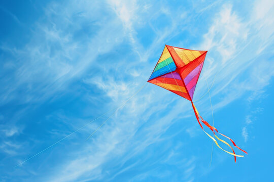 Colorful kite flying in a blue sky