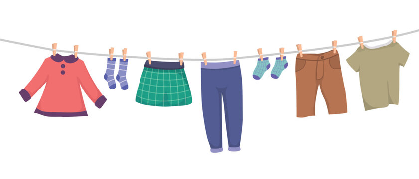 Set of children clothes hanging on rope clothesline