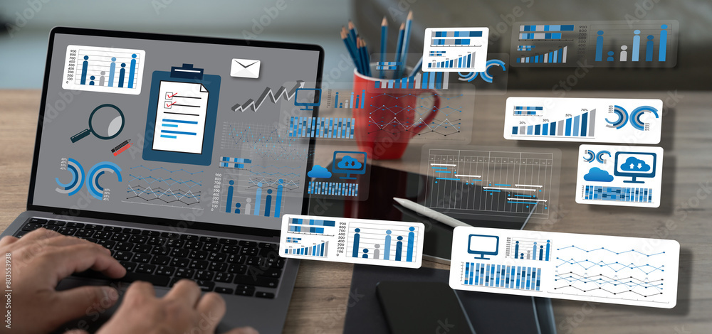 Poster using a computer, an analysis businessman working at a home office while standing at a desk is the d