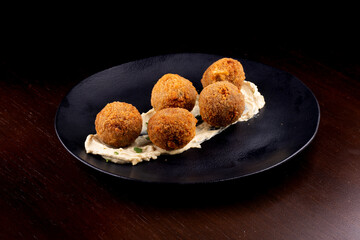 Fried fish cake salmon cod appetizer on wooden table