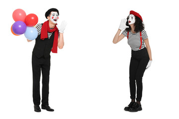 Two funny mimes performing on white background