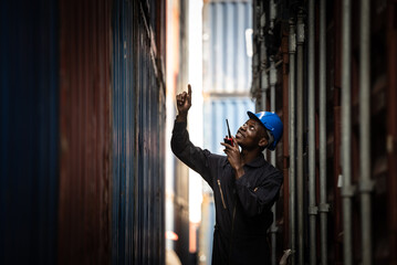 Port official African-Americans inspect containers at the port.