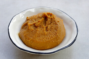 Japanese miso paste in white bowl