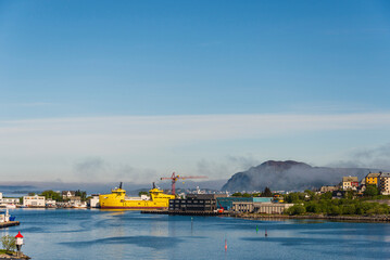 Fototapeta premium view of the city of Alesund shrouded in fog, Norway