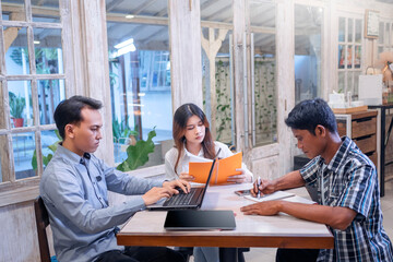 Man and woman business colleagues discussing a business project plan during a meeting