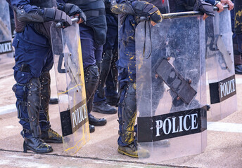 Riot police dispersed protesters and were pelted with paint.
