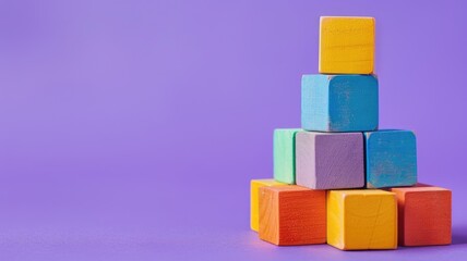 Colorful blocks stacked on purple background