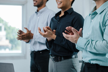 Group of teamwork businessman are clapping hands to success and archive on business financial and...