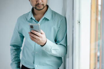 Businessman Using smartphone for communicate with client and colleague about business financial and...