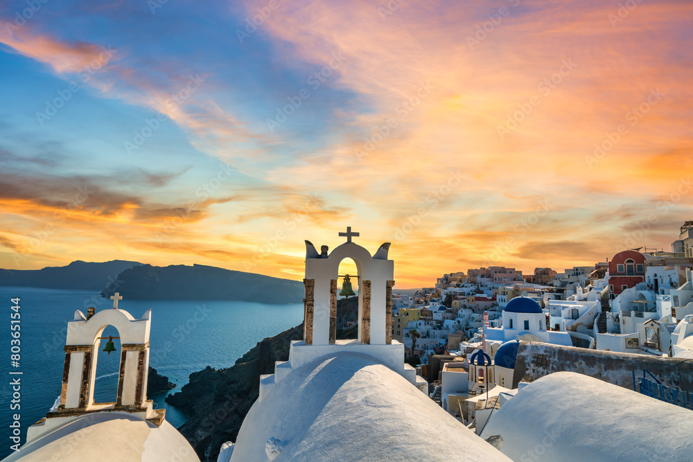 Canvas Prints Famous Santorini island bell towers at sunset. Oia village. Greece