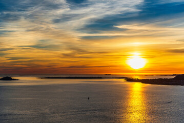  top view of a sunset over The city of Alesund and the sea during a sunny evening, Norway