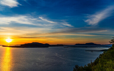 top view of a sunset over The city of Alesund and the sea during a sunny evening, Norway