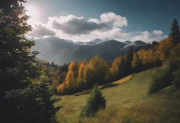 Autumn landscape with sunlit golden trees and mountain range in the background under a cloudy sky. Mountain Day.