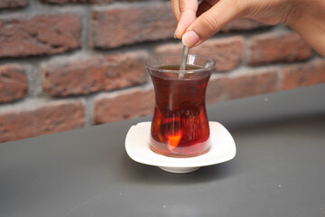 Traditional turkish tea on white table .