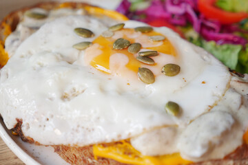 closeup of fried egg on toast.