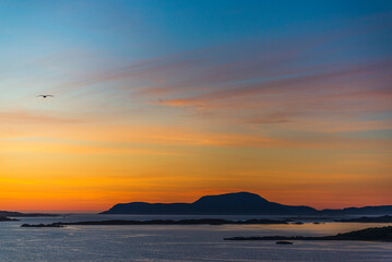 top view of a sunset over The city of Alesund and the sea during a sunny evening, Norway