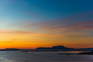top view of a sunset over The city of Alesund and the sea during a sunny evening, Norway