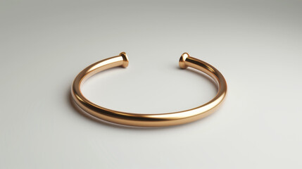 A minimalist gold open bangle bracelet displayed on a seamless white background, reflecting luxury and simplicity.