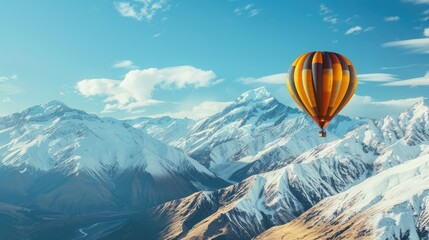 Fototapeta premium Hot air balloon floating over snow mountain with copy space area.