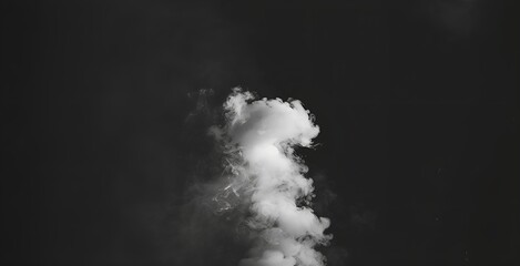 Wispy white smoke cloud rising up on a black background