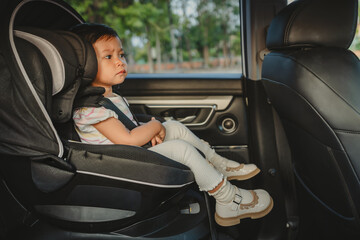 toddler girl sitting in car seat, safety baby chair