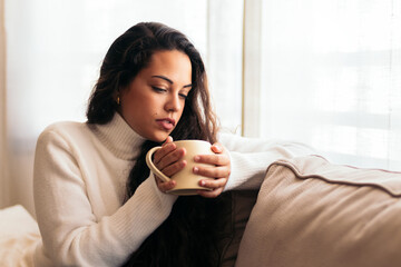 Enjoying Morning at Home: Young Woman Drinking Coffee