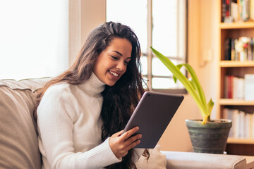 Connected Youth: A Young Woman Using a Tablet at Home