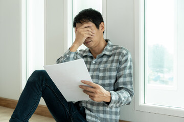 Depression and mental illness. Asian man disappoint, sad after receive bad news. Stressed boy...