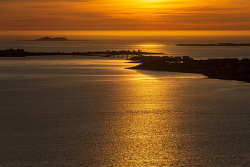Fototapeta premium top view of a sunset over Alesund during a sunny spring evening, Norway