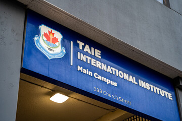 Naklejka premium TAIE International Institute logo sign. TAIE International Institute is an international high school. Toronto, Canada - April 29, 2024.