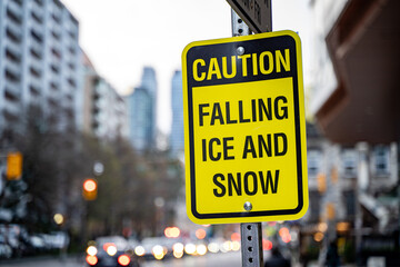 Caution, Falling Ice and Snow warning sign.