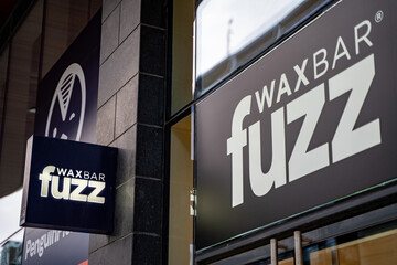 Naklejka premium Fuzz Wax Bar logo sign. Toronto, Canada - April 29, 2024.