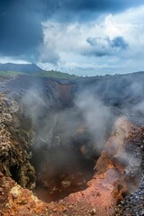 Step into the surreal beauty of a volcanic crater, where steaming vents and bubbling mud pools create an otherworldly landscape of, Generative AI