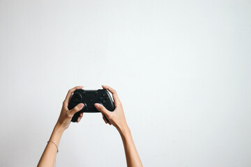 Woman hands holding black joystick isolated on white background