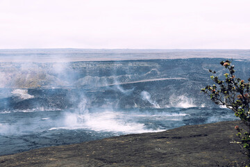 Kilauea Volcano in Hawaii after eruption still have smoke flows over white background sky and the area, Hawaii Island.