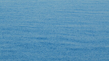 Morning Blue Calm Sea. Natural Blue Background. Wide Open Sea Side With Ripples Of Waves. Still.