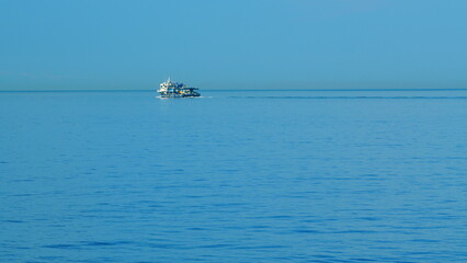 Obraz premium Fishing Ship On The Black Sea. Fishing Boat Trawler Ship Sailing On Sea. Still.